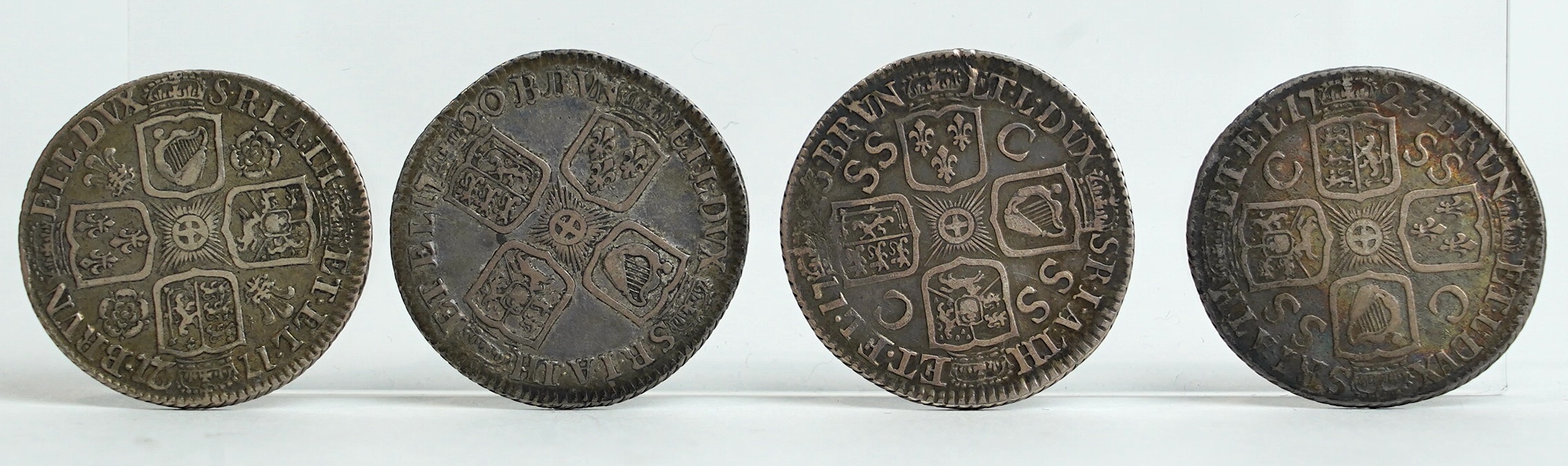 British silver coins, George I, four shilling coins, 1720, good fine, 1721/0, good fine, two 1723, SSC in angles, both fine/good fine, a sixpence 1723, SSC in angles, about VF, and a fourpence 1723, creased otherwise goo